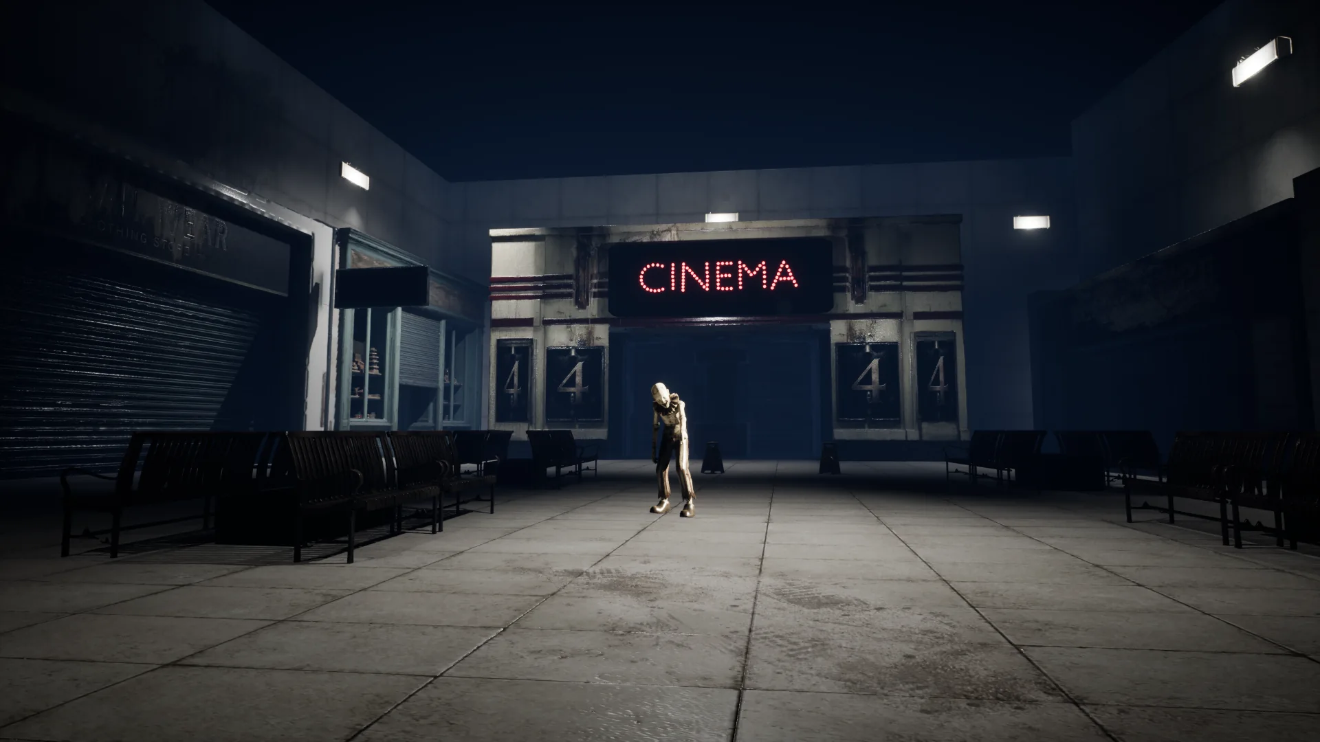 Atmospheric cinema entrance with a figure in Las 5 Celdas
