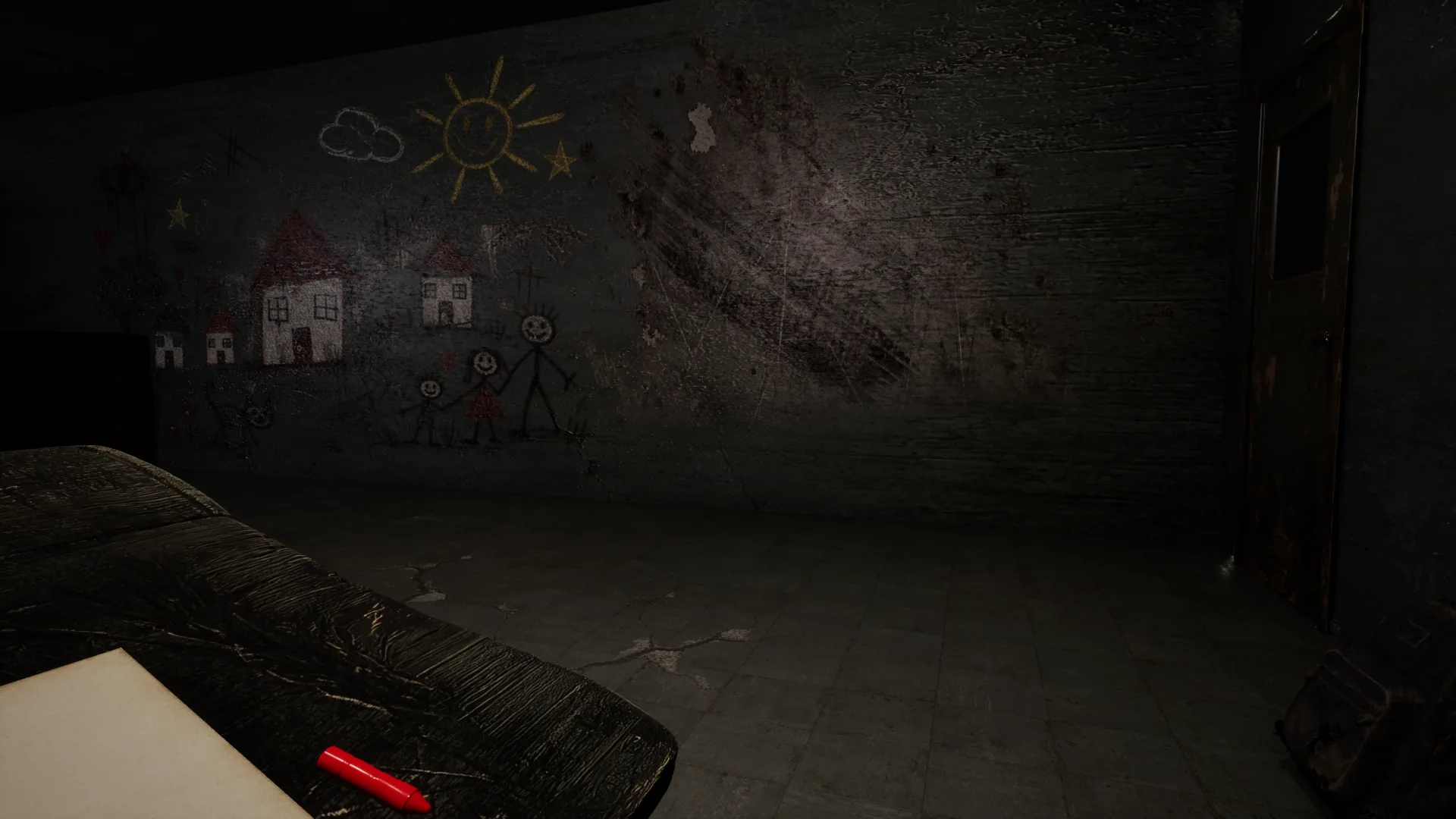 Drawings on a dark classroom wall